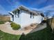 View of the exterior siding, windows, walkway, and lawn at 611 W South St, Shelbyville, IN 46176