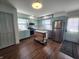 Updated kitchen with light green cabinets, stainless appliances and a cozy breakfast nook at 611 W South St, Shelbyville, IN 46176