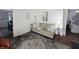 Comfortable living room with a sofa, decorative pillows, and a view into an adjacent bedroom at 611 W South St, Shelbyville, IN 46176