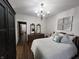 Cozy bedroom features a comfortable bed, vintage dresser and decorative accents, creating a relaxing retreat at 611 W South St, Shelbyville, IN 46176