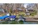 Lakefront homes offer multiple decks, a lakeside dock, and mature trees surrounding manicured lawn at 6290 Grouse Dr, Nineveh, IN 46164