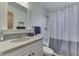 Bathroom with decorative towel racks, vanity, sink, and shower/tub combo at 6290 Grouse Dr, Nineveh, IN 46164