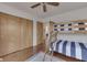 Bedroom with wood bunk beds, hardwood floors, closet, rug, and interior doorway at 6290 Grouse Dr, Nineveh, IN 46164