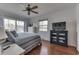 Cozy bedroom with a comfortable bed, hardwood floors, and a TV cabinet, offering a relaxing retreat at 6290 Grouse Dr, Nineveh, IN 46164