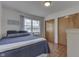 Bedroom includes a queen bed, wood floors, and closet space at 6290 Grouse Dr, Nineveh, IN 46164