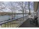 Enjoy this outdoor deck with lake view and chairs at 6290 Grouse Dr, Nineveh, IN 46164
