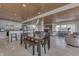 Dining area with table, chairs and bench, wood ceiling, open to the kitchen and living area at 6290 Grouse Dr, Nineveh, IN 46164