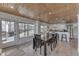 Bright dining area with wood-paneled ceiling and large windows, perfect for Gathering gatherings and entertaining at 6290 Grouse Dr, Nineveh, IN 46164
