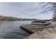 Waterfront property featuring a dock and boat slip, perfect for enjoying lake living and water activities at 6290 Grouse Dr, Nineveh, IN 46164