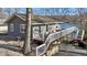 Charming home exterior with a spacious deck overlooking the lake at 6290 Grouse Dr, Nineveh, IN 46164