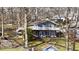 Charming home features a large deck with lake views, with stairs to access the yard at 6290 Grouse Dr, Nineveh, IN 46164
