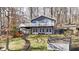 Charming home features a large deck with lake views, with stairs to access the yard at 6290 Grouse Dr, Nineveh, IN 46164