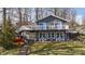 Inviting two-story lake house featuring a spacious deck and beautiful views at 6290 Grouse Dr, Nineveh, IN 46164