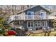 Inviting two-story lake house featuring a spacious deck and beautiful views at 6290 Grouse Dr, Nineveh, IN 46164