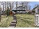Charming lake house with a stepped path and lake views at 6290 Grouse Dr, Nineveh, IN 46164