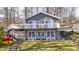 Inviting two-story lake house featuring a spacious deck and beautiful views at 6290 Grouse Dr, Nineveh, IN 46164