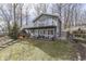 Charming home features a large deck with lake views, with stairs to access the yard at 6290 Grouse Dr, Nineveh, IN 46164
