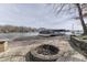 Outdoor firepit and dock offering a relaxing space for enjoying the lakeside atmosphere and boating activities at 6290 Grouse Dr, Nineveh, IN 46164