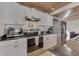 Kitchen with stainless steel appliances, black granite countertops, and white cabinets at 6290 Grouse Dr, Nineveh, IN 46164