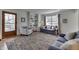 Bright living room with hardwood floors, built-in shelves, and comfortable seating in a cozy design at 6290 Grouse Dr, Nineveh, IN 46164