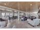 Open living space with tile floors, dining area, kitchen, sitting area, and stairs to the second floor at 6290 Grouse Dr, Nineveh, IN 46164