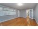Spacious living room with hardwood floors, neutral paint, and abundant natural light at 6407 Brokenhurst Rd, Indianapolis, IN 46220