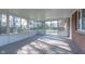 Glass enclosed sunroom provides ample natural light and views of the backyard and patio at 6407 Brokenhurst Rd, Indianapolis, IN 46220