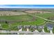 Beautiful aerial view of a well manicured property in a rural neighborhood and a pond at 6862 School Branch Dr, Brownsburg, IN 46112