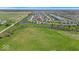 A beautiful aerial view of a Gathering-friendly neighborhood with ponds and green spaces at 6862 School Branch Dr, Brownsburg, IN 46112