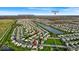 Aerial view of a community with houses, ponds, and proximity to Eagle Creek Golf Course and Downtown at 6862 School Branch Dr, Brownsburg, IN 46112