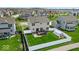 A large manicured backyard with a white fence, deck, and greenhouse at 6862 School Branch Dr, Brownsburg, IN 46112