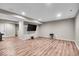 Finished basement with laminate flooring, recessed lighting and ample space for various activities at 6862 School Branch Dr, Brownsburg, IN 46112