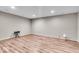 Spacious basement area featuring laminate flooring, recessed lighting, and ample room for various activities at 6862 School Branch Dr, Brownsburg, IN 46112