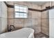 Well-lit bathroom featuring a standalone tub and tiled shower at 6862 School Branch Dr, Brownsburg, IN 46112