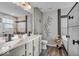 Modern bathroom with double vanity, decorative accents, and luxurious soaking tub at 6862 School Branch Dr, Brownsburg, IN 46112
