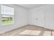 Bedroom featuring neutral carpet, natural light from window, and a double-door closet at 6862 School Branch Dr, Brownsburg, IN 46112