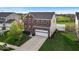 Desirable home featuring a well-manicured lawn, brick facade, two-car garage, and inviting curb appeal at 6862 School Branch Dr, Brownsburg, IN 46112