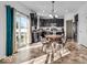 Eat-in kitchen with black cabinets, stainless steel appliances and sliding door to patio at 6862 School Branch Dr, Brownsburg, IN 46112