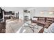 Bright living room with modern decor, wood floors, and a comfortable leather sofa at 6862 School Branch Dr, Brownsburg, IN 46112