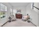 Cozy sitting room with natural light, an upright piano and stylish chairs at 6862 School Branch Dr, Brownsburg, IN 46112