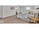 Bright bedroom with carpet, ensuite bathroom, and bedside table with lamp at 6862 School Branch Dr, Brownsburg, IN 46112
