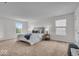 Bright main bedroom with neutral tones, carpet, and large windows at 6862 School Branch Dr, Brownsburg, IN 46112