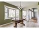 Sunlit breakfast nook with bay window and a wooden table at 7616 Newport Bay E Dr, Indianapolis, IN 46240