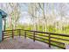 Wooden deck featuring a forest view, providing a relaxing outdoor space at 7616 Newport Bay E Dr, Indianapolis, IN 46240