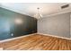 Elegant dining room featuring a chandelier and wood floors at 7616 Newport Bay E Dr, Indianapolis, IN 46240