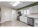 Functional kitchen with white cabinets, modern appliances, and ample countertop space at 7616 Newport Bay E Dr, Indianapolis, IN 46240