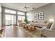 Comfortable living room featuring sliding glass doors, a fireplace, and tastefully arranged furniture at 7616 Newport Bay E Dr, Indianapolis, IN 46240