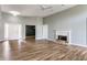 Bright living room with white trim, fireplace, and wood floors at 7616 Newport Bay E Dr, Indianapolis, IN 46240