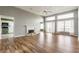Spacious living room with a fireplace, ample natural light, and beautiful hardwood flooring at 7616 Newport Bay E Dr, Indianapolis, IN 46240
