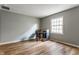 An office space featuring wood floors, neutral walls, and natural light at 7616 Newport Bay E Dr, Indianapolis, IN 46240